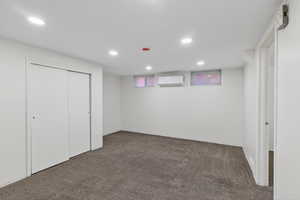 Unfurnished bedroom with recessed lighting, carpet flooring, and a closet