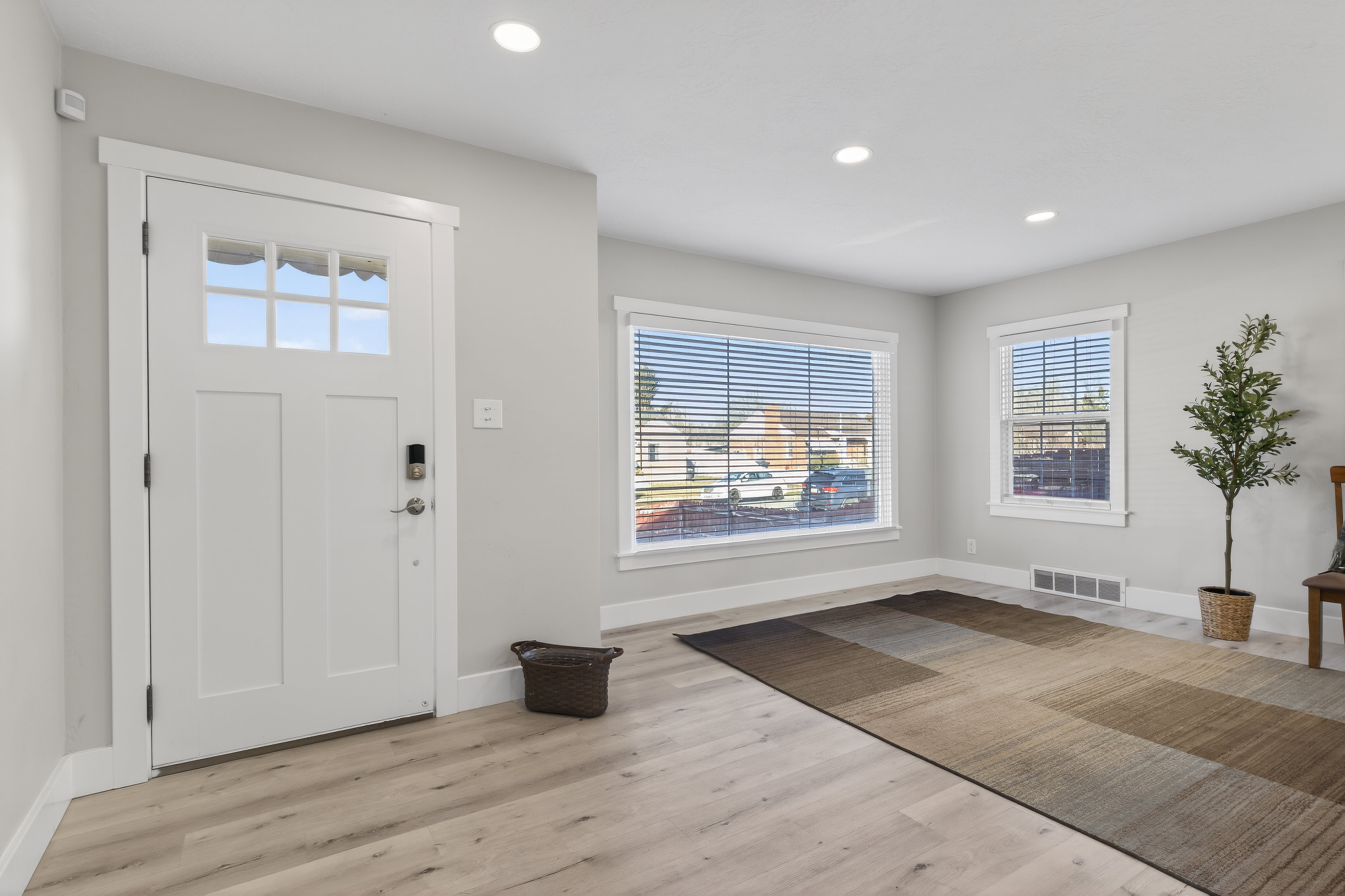 Foyer featuring plenty of natural light, light wood-style flooring, and recessed lighting