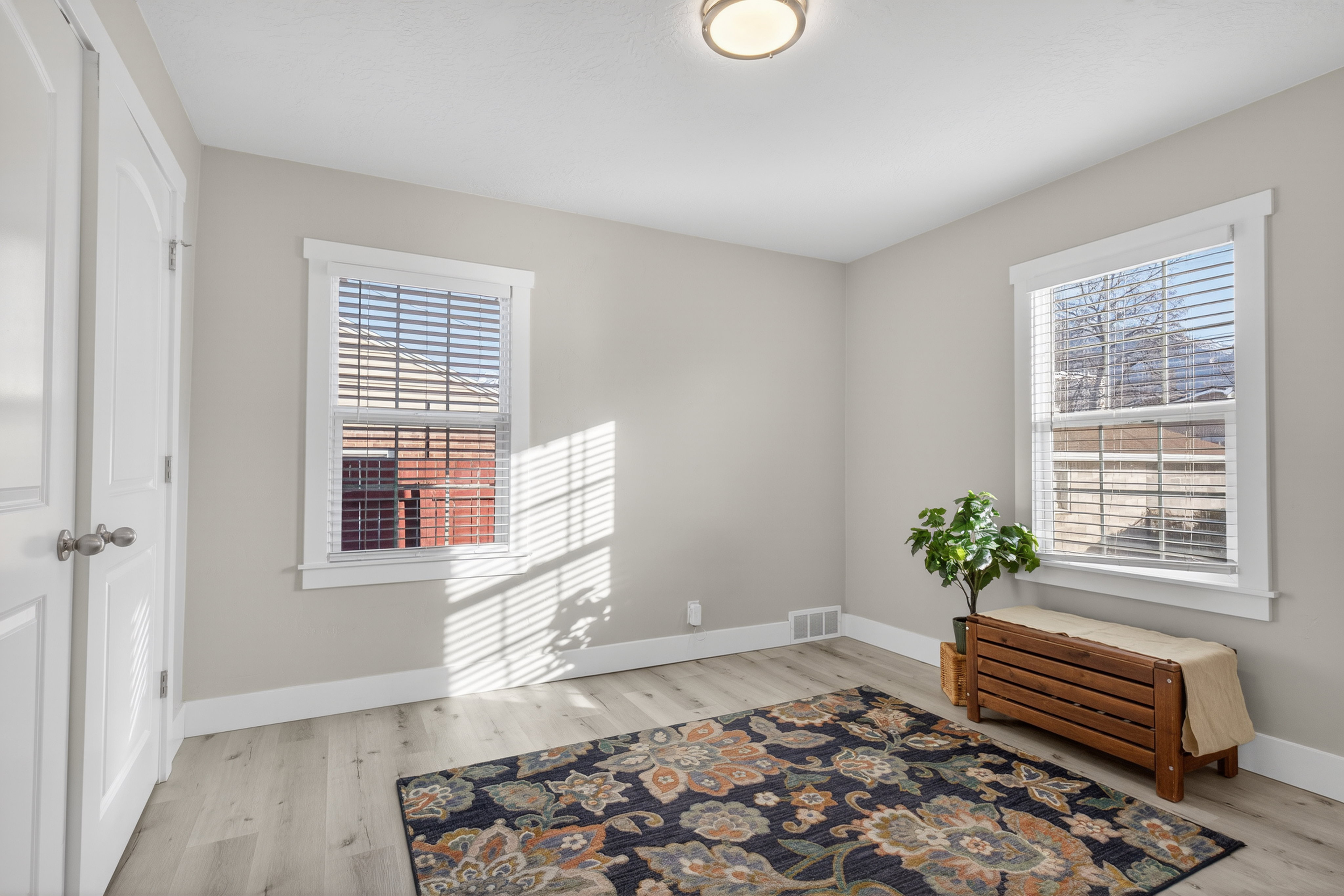Sitting room featuring light wood-type flooring and baseboards