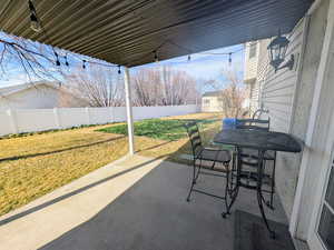 Fenced backyard featuring outdoor dining area and a patio area