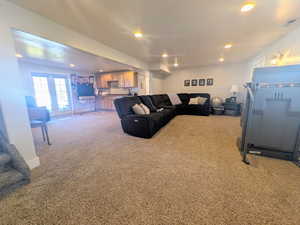 Living room with recessed lighting and light carpet