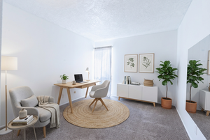 Home office featuring carpet flooring and a textured ceiling