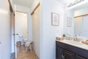 Bathroom with vanity and light wood-type flooring