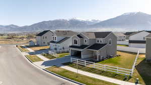 View of mountain background featuring nearby suburban area