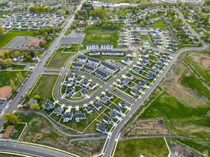Aerial view of property's location with nearby suburban area