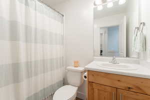 Bathroom with vanity and a shower with curtain