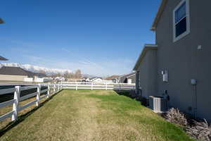 Fenced backyard with a residential view