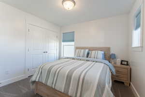 Bedroom with carpet floors and a closet