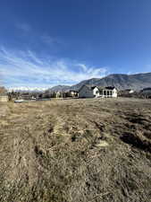 View of yard featuring a mountain view and a view of countryside