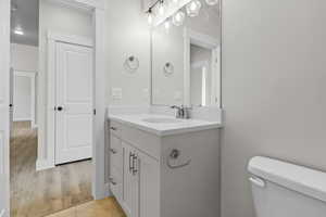 Bathroom featuring vanity and toilet