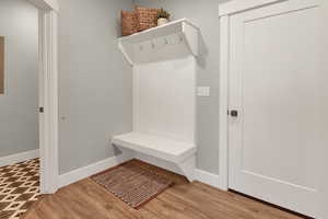 Mudroom with light wood-style flooring