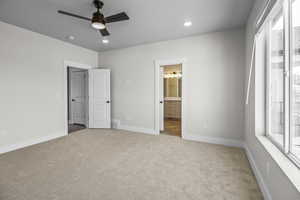 Unfurnished bedroom with carpet floors, a ceiling fan, ensuite bath, and recessed lighting