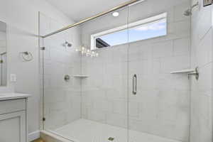 Bathroom with a stall shower and vanity