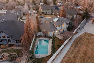 Aerial perspective of suburban area with a pool area