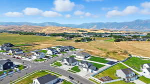 Aerial view of residential area featuring a mountain backdrop