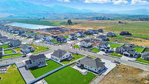 Aerial perspective of suburban area with a mountainous background
