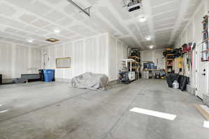 Large extended 3rd car garage with a garage door opener