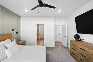 Primary Bedroom featuring a ceiling fan, light carpet, and recessed lighting