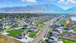 Aerial perspective of suburban area featuring a mountainous background