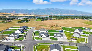 Aerial view of residential area featuring a mountainous background