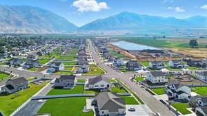 Aerial perspective of suburban area with a water and mountain view