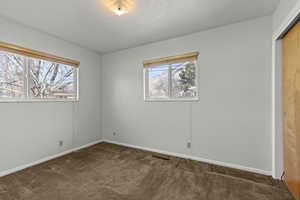 Unfurnished bedroom with a closet and carpet floors
