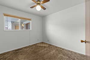 Unfurnished room with carpet and ceiling fan