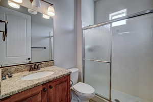 Full bathroom featuring vanity and a stall shower