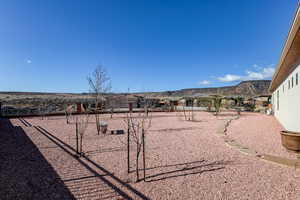 View of yard with a playground and a mountain view