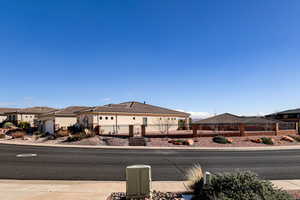 View of asphalt street with sidewalks, curbs, and a residential view