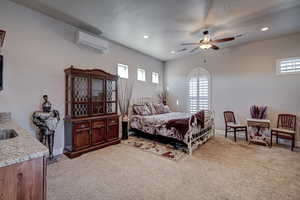 Bedroom with light carpet, ceiling fan, multiple windows, and recessed lighting