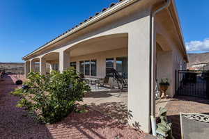 View of patio / terrace featuring a gate and a mountain view