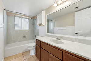 Full bathroom featuring vanity, bathing tub / shower combination, and light tile patterned floors