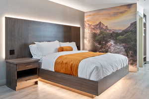 Bedroom with wood finished floors