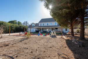 Rear view of property with a patio area