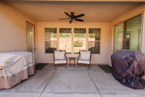 View of patio / terrace featuring area for grilling and ceiling fan