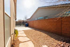 Fenced backyard featuring a patio area