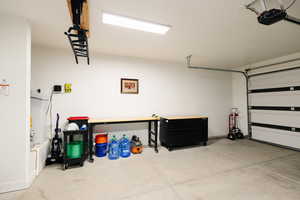 Garage featuring a garage door opener