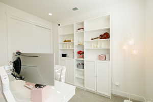 Office featuring light carpet and recessed lighting