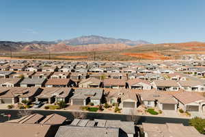 Aerial perspective of suburban area featuring a mountain backdrop