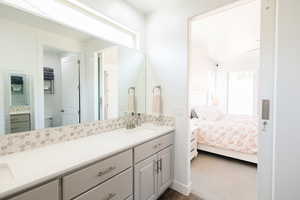 Ensuite bathroom with double vanity and toilet