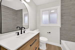Bathroom with vanity and light wood-style floors