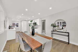 Dining room featuring light wood-type flooring and recessed lighting