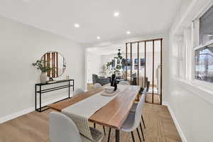 Dining space featuring light wood-style flooring, recessed lighting, and a ceiling fan