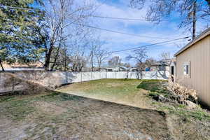 View of fenced backyard