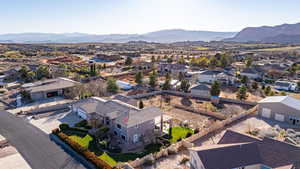 Aerial view of residential area featuring a mountainous background