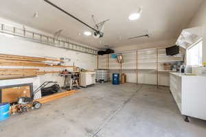 Garage featuring a garage door opener