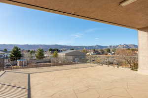 View of patio featuring a residential view and a mountain view