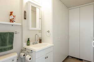 Half bath with vanity and toilet