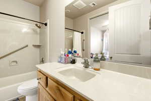 Full bath featuring vanity and shower / bath combination with curtain